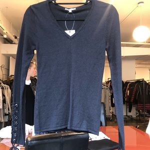 Black v neck pullover with tie detail at sleeve